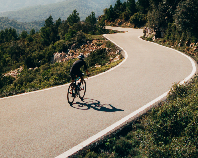 Cycling in Banyalbufar Cyclist on a mountain road